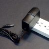 AC Adapter 12V 2A Slim - Plugged into Strip